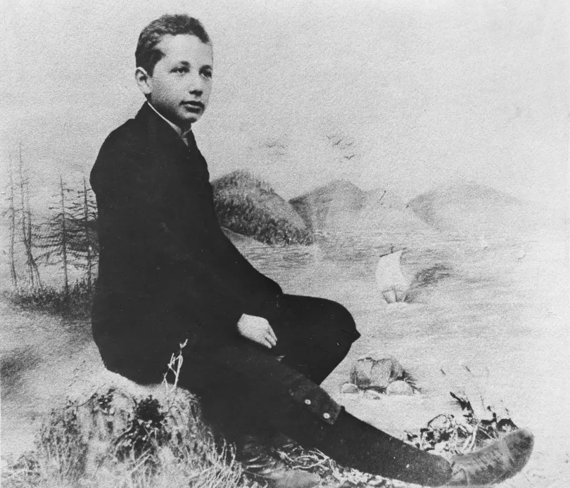 Young Albert Einstein as a boy, seated outdoors