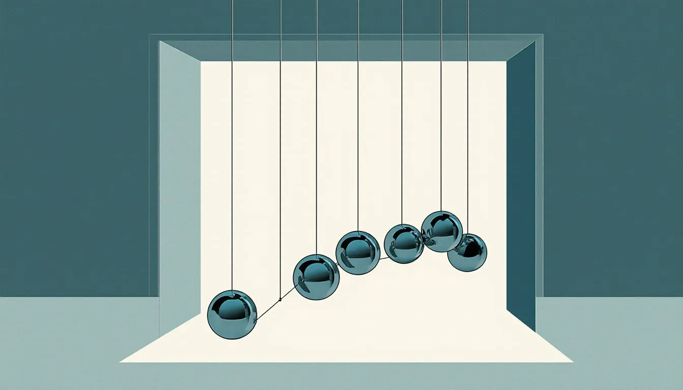 A Newton's cradle with one steel ball pulled back, illustrating the transfer of momentum between spheres