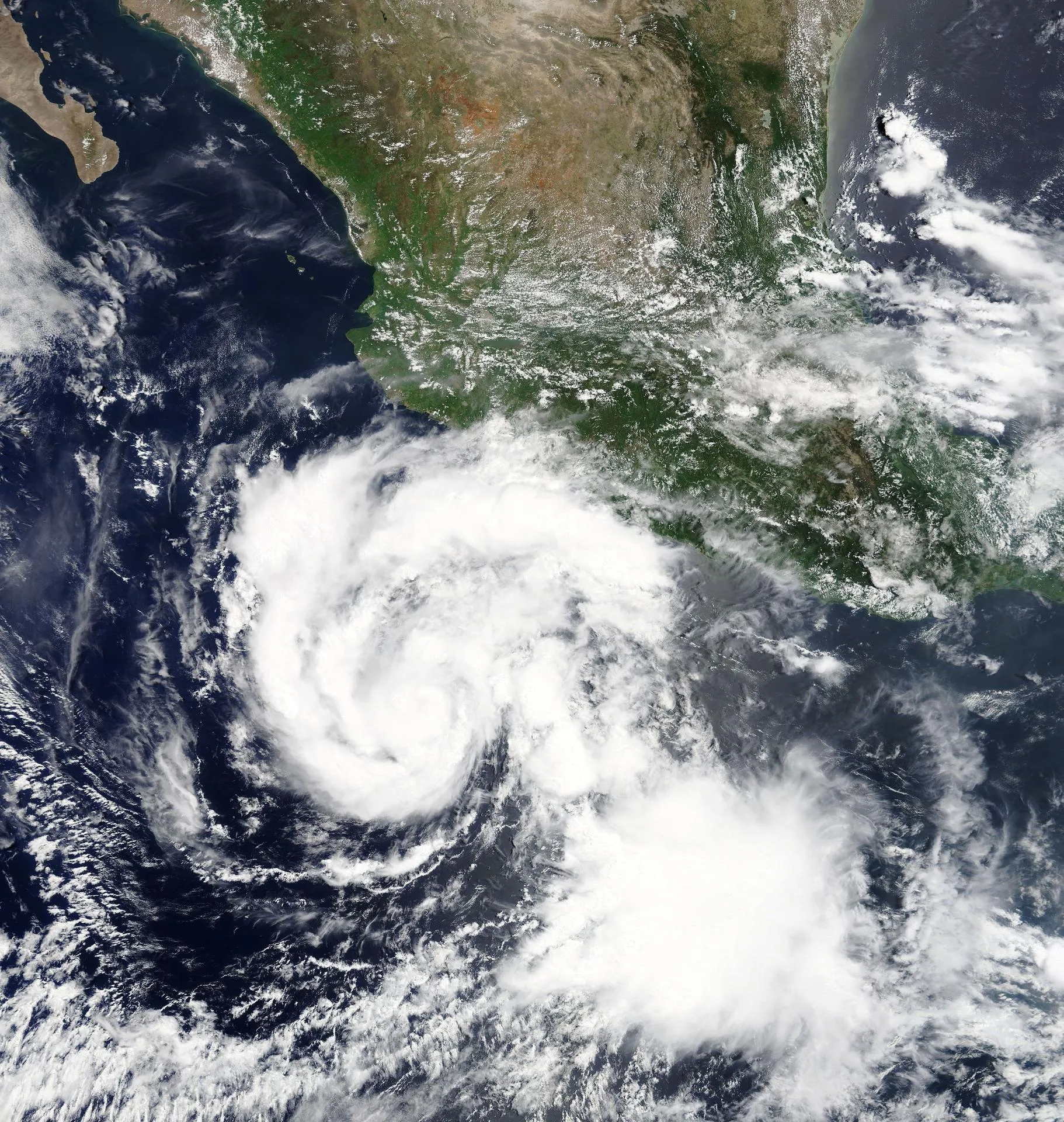 Satellite view of a powerful hurricane spinning off a coastline