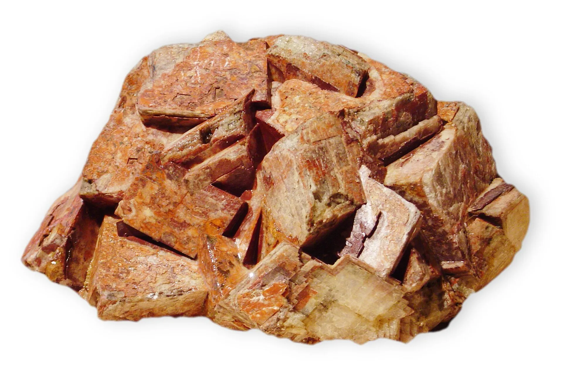 Cluster of salmon-pink feldspar crystals on a white background