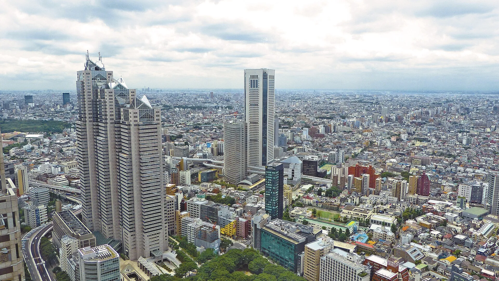 Aerial view of Tokyo's dense skyline stretching to the horizon