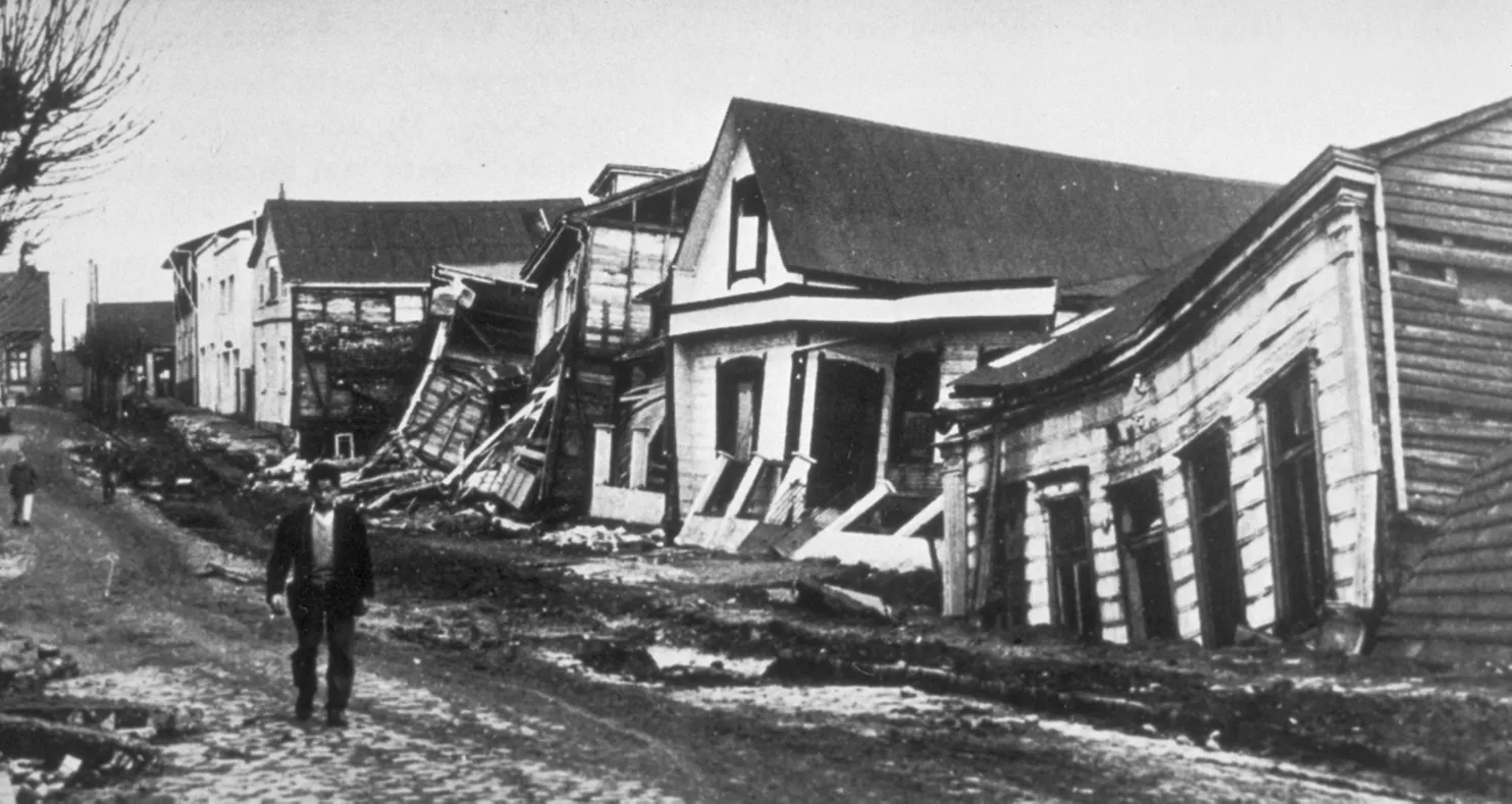 Street of wrecked wooden houses after the 1960 Valdivia earthquake in Chile