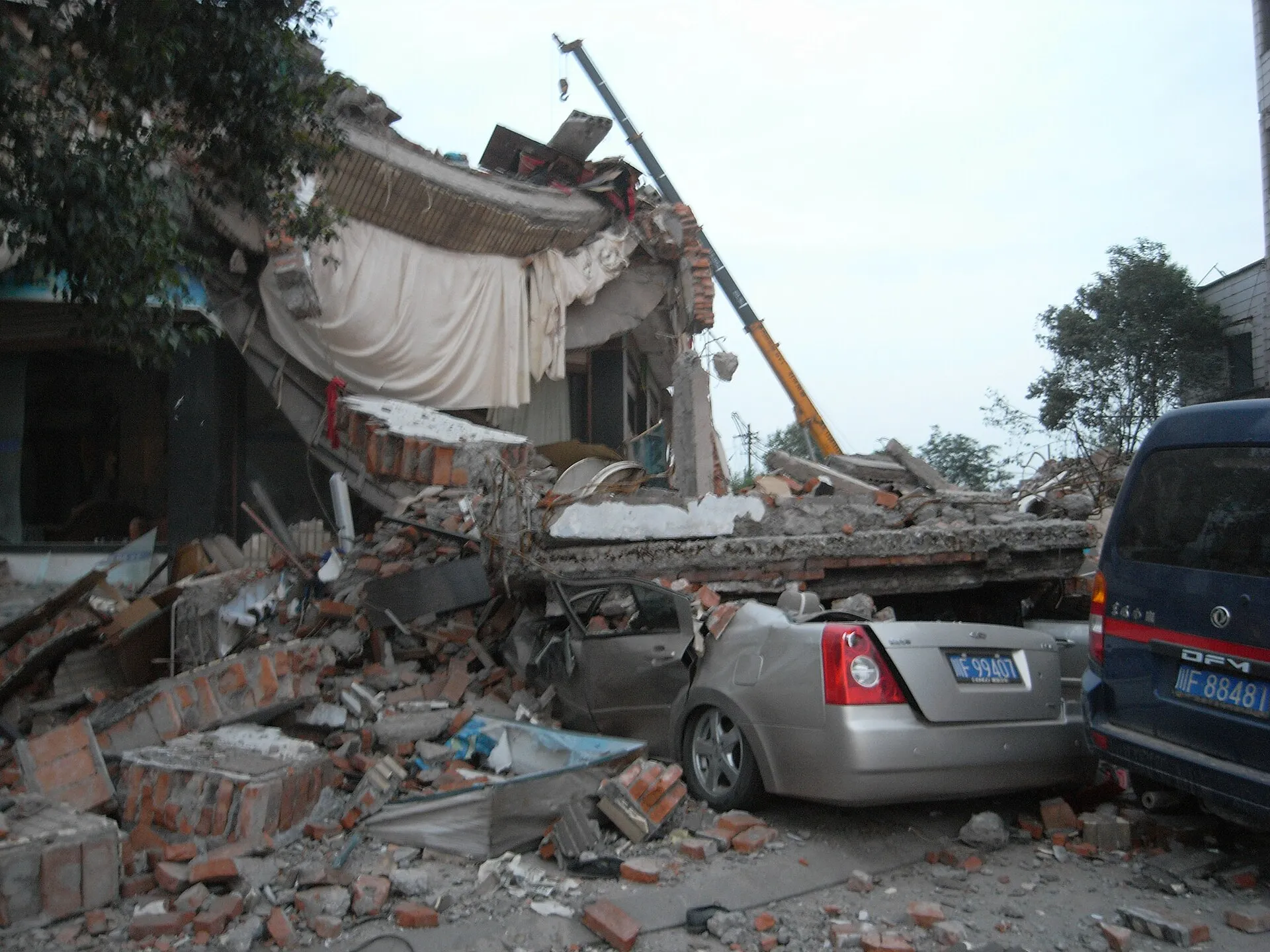 Rescuers working beside a collapsed building after the 2008 Sichuan earthquake