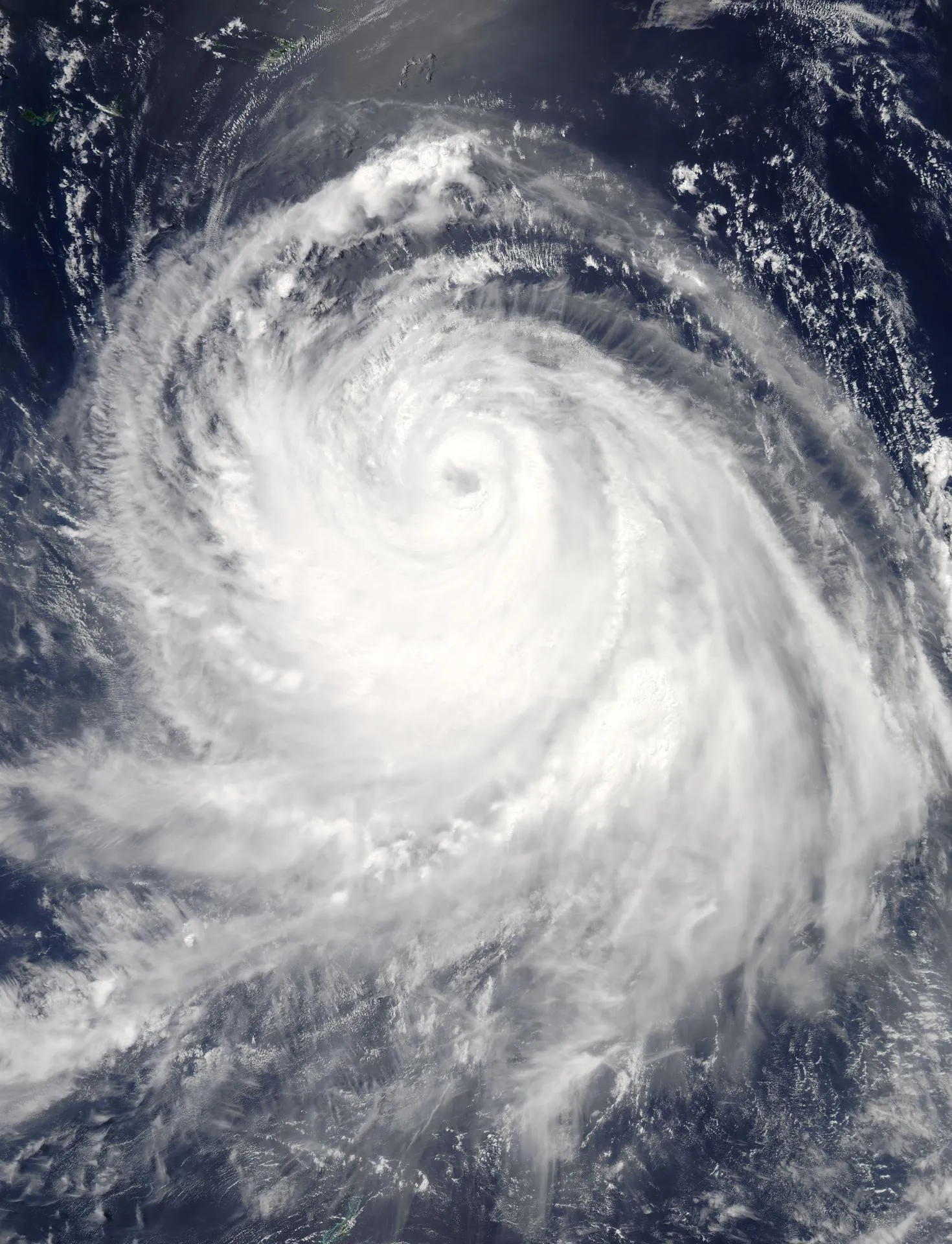 Satellite view of a typhoon's spiral cloud bands over the Pacific